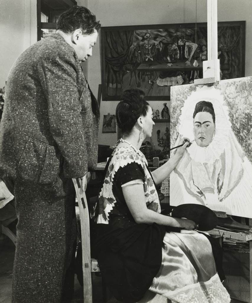 United States, Diego Rivera Watching Frida Kahlo Paint a Self Portrait, circa 1940