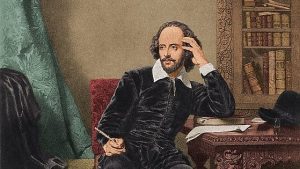 immagine di William Shakespeare seduto alla scrivania